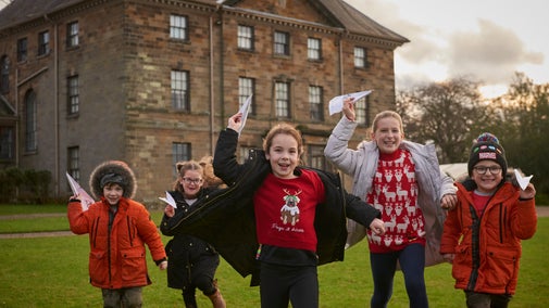 Young visitors exploring the park during their visit at Christmas at Ormesby Hall, North Yorkshire